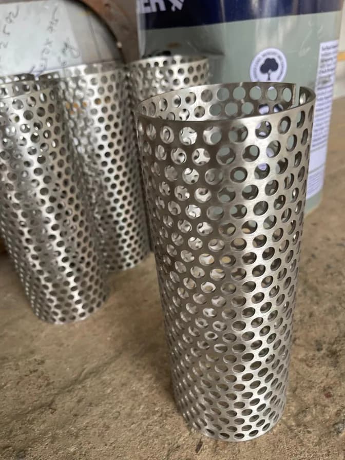 Rolled and perforated stainless steel cylinders produced for filtration equipment