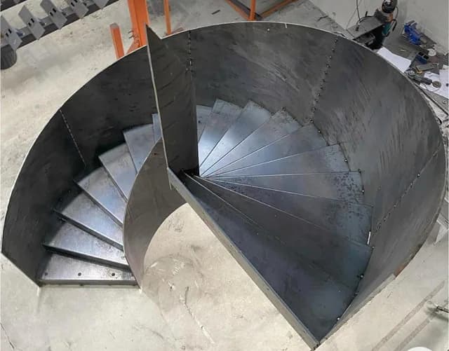 Fabricated steel spiral staircase structure awaiting finishing